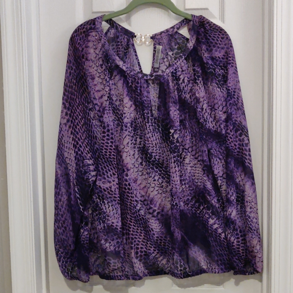Jennifer Lopez purple blouse with gold neck accent